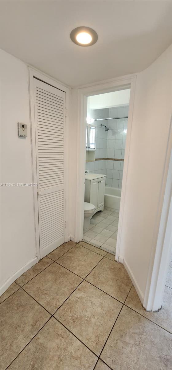 3670 Southwest 10th Street, Unit 10B Miami, FL 33135 - Photo 8 of 14 a view of a closet area with living room