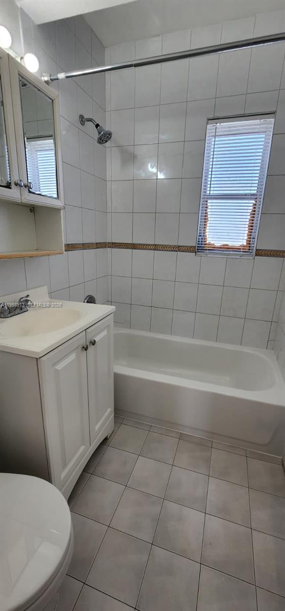 3670 Southwest 10th Street, Unit 10B Miami, FL 33135 - Photo 9 of 14 a bathroom with a sink a toilet and bathtub