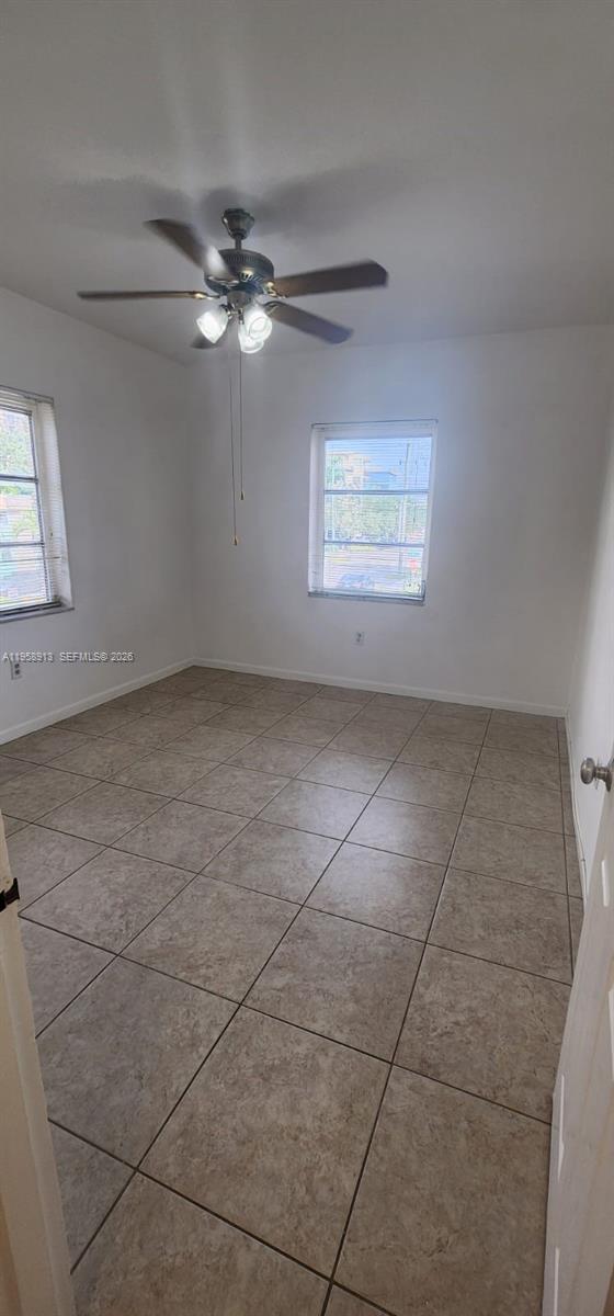 3670 Southwest 10th Street, Unit 10B Miami, FL 33135 - Photo 10 of 12 a view of an empty room with a window