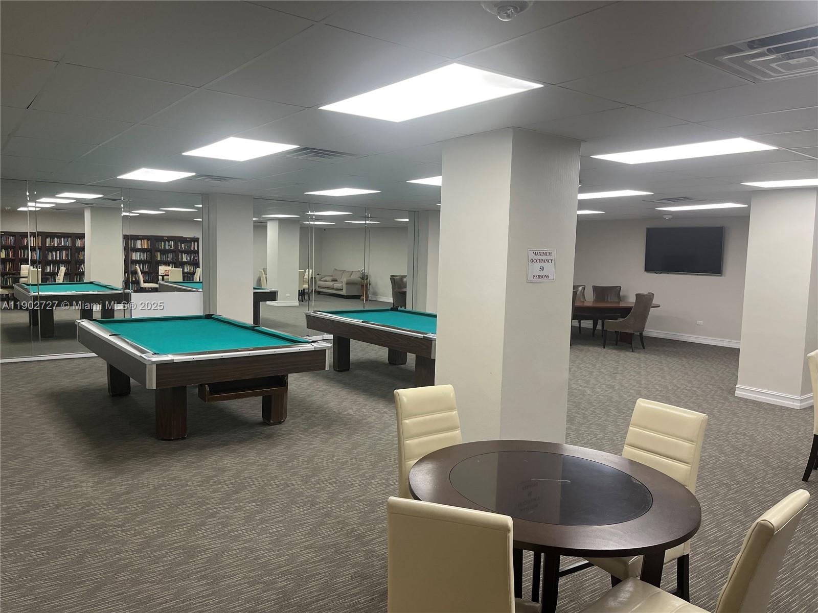 5005 Collins Avenue, Unit 923 Miami Beach, FL 33140 - Photo 13 of 17 a living room with furniture and a table