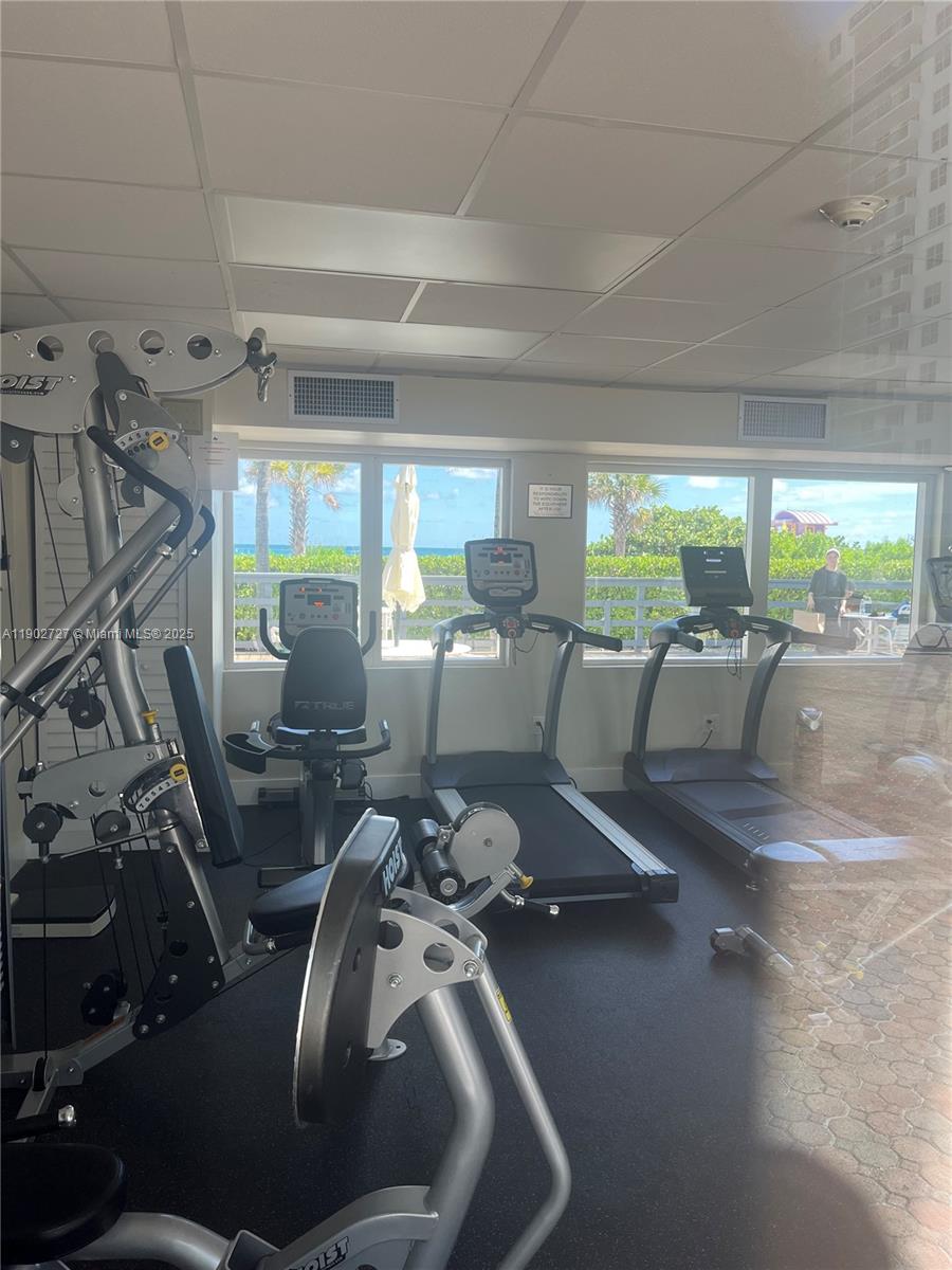 5005 Collins Avenue, Unit 923 Miami Beach, FL 33140 - Photo 14 of 17 a view of a room with gym equipment