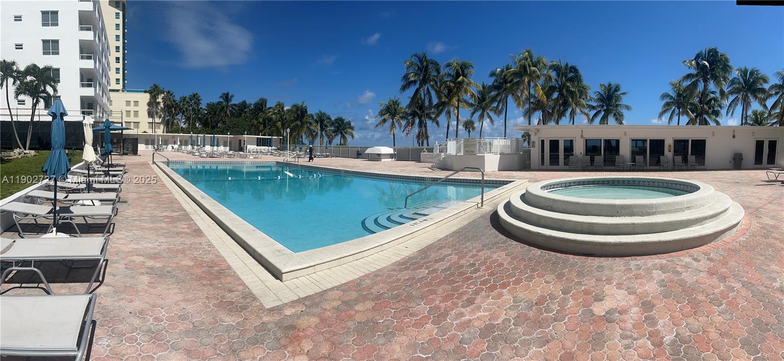 5005 Collins Avenue, Unit 923 Miami Beach, FL 33140 - Photo 9 of 17 a view of a swimming pool with a patio