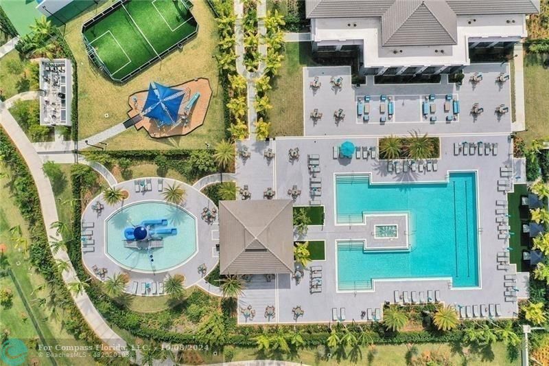 10610 Waves Way Parkland, FL 33076 - Photo 33 of 53 an aerial view of residential houses with outdoor space and parking