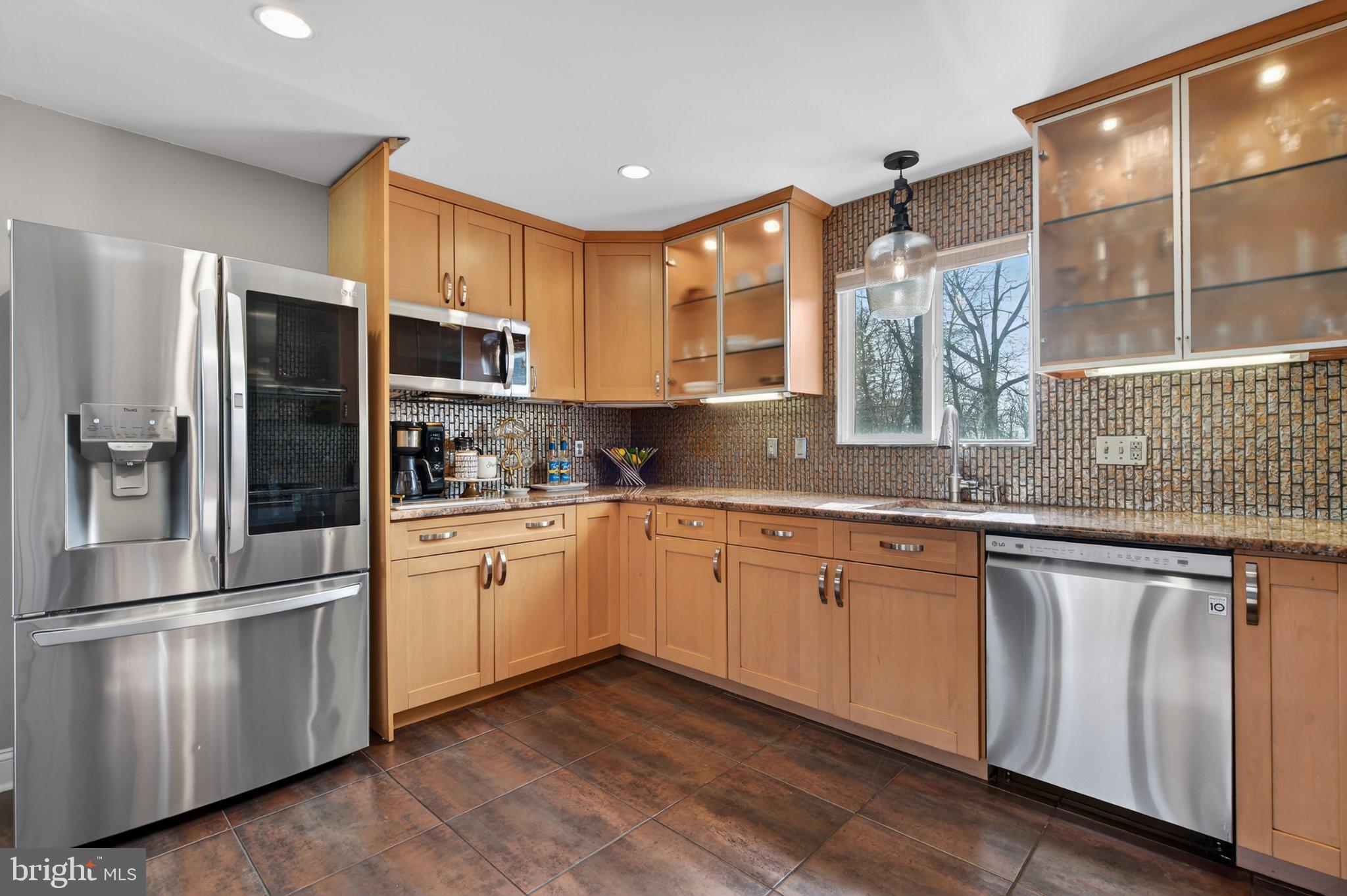 1100 South Valley Forge Road Lansdale, PA 19446 - Photo 9 of 43 Modern kitchen with warm wood tones.