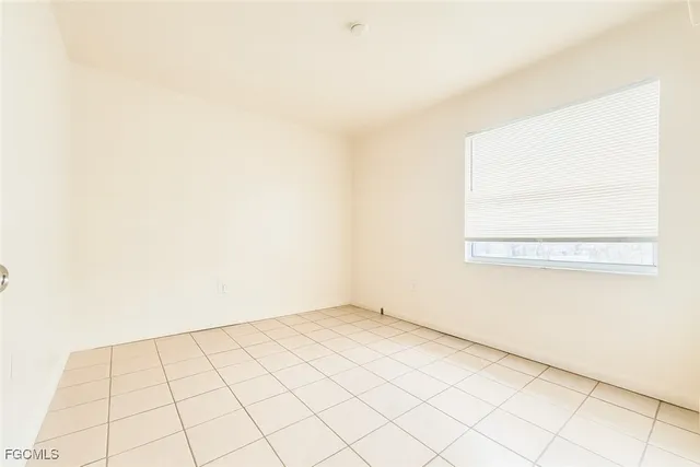 an empty room with a bench