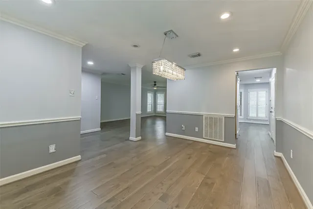 wooden floor in an empty room with a mirror