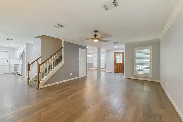 a view of an entryway with wooden floor