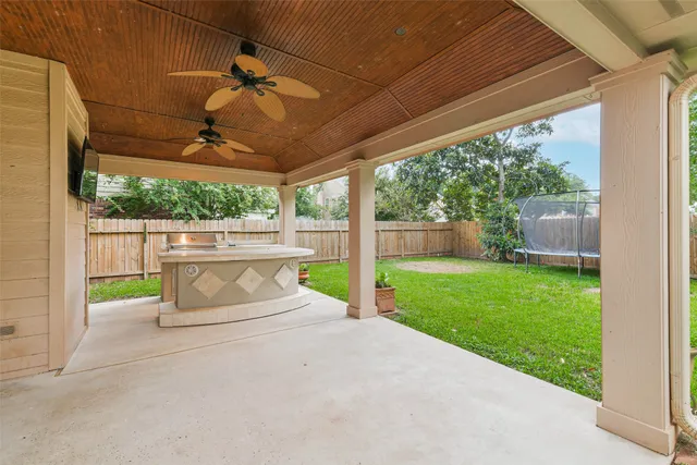 a view of swimming pool with a patio