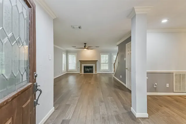 wooden floor in an empty room with a fireplace