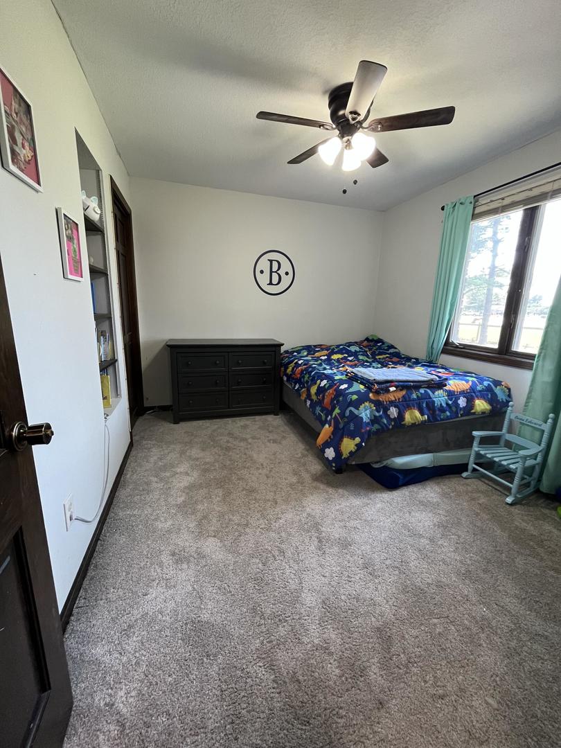 57 Jibby Estates Sullivan, IL 61951 - Photo 12 of 16 a bedroom with a bed and a window