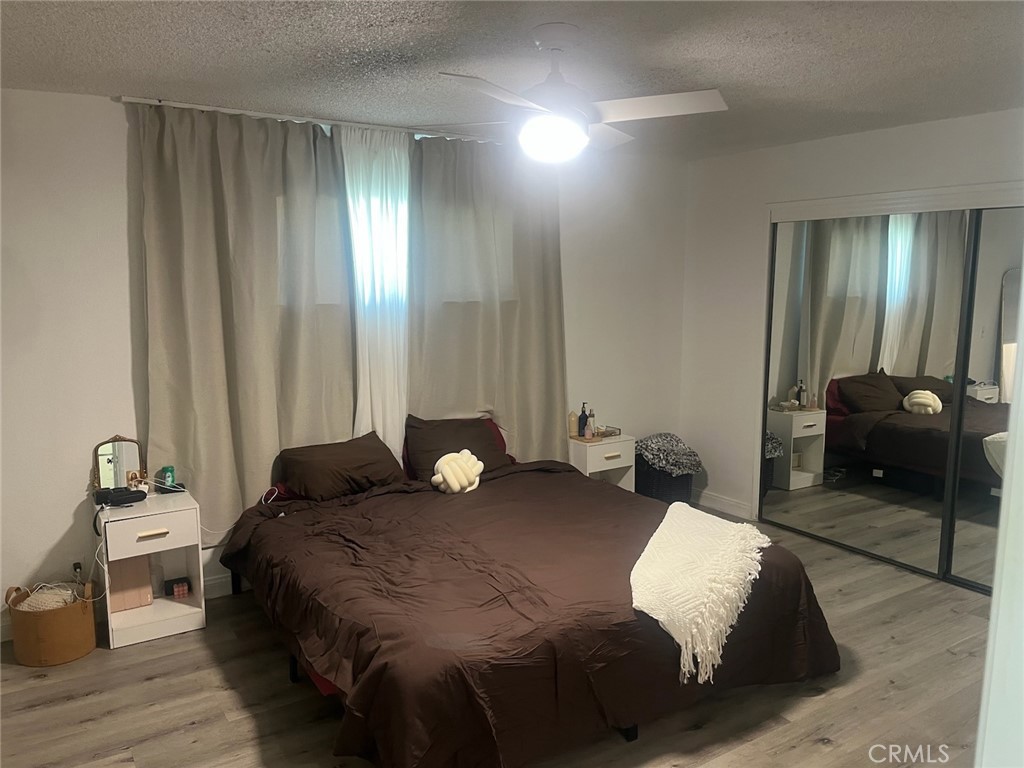 44706 Sarah Lane Lancaster, CA 93535 - Photo 12 of 17 a bedroom with a bed and a large mirror