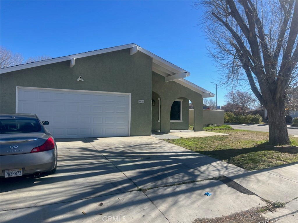 44706 Sarah Lane Lancaster, CA 93535 - Photo 2 of 17 a view of a house with a yard