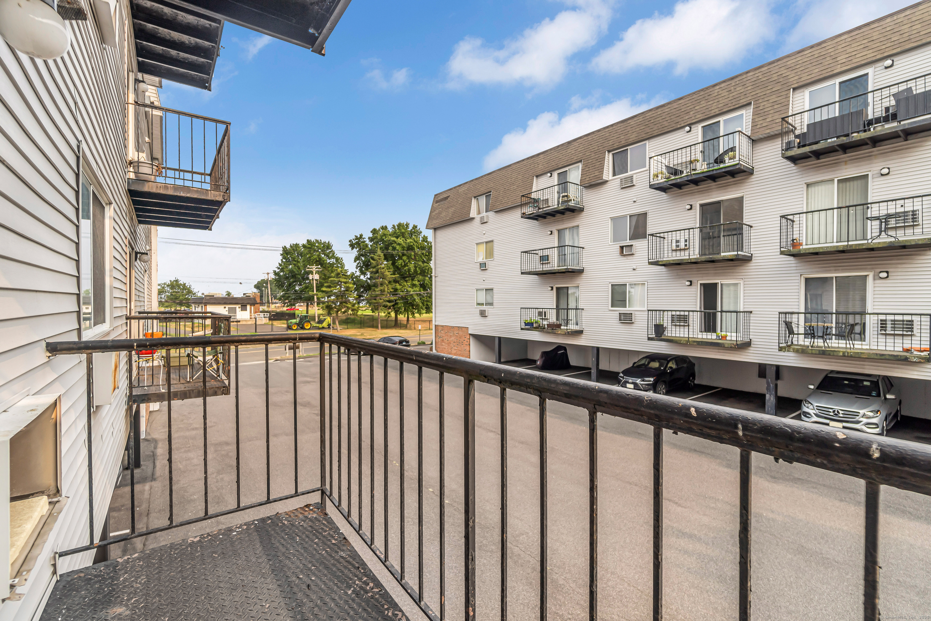 115 Short Beach Road, Unit 104 Stratford, CT 06615 - Photo 14 of 19 a view of a building from a balcony