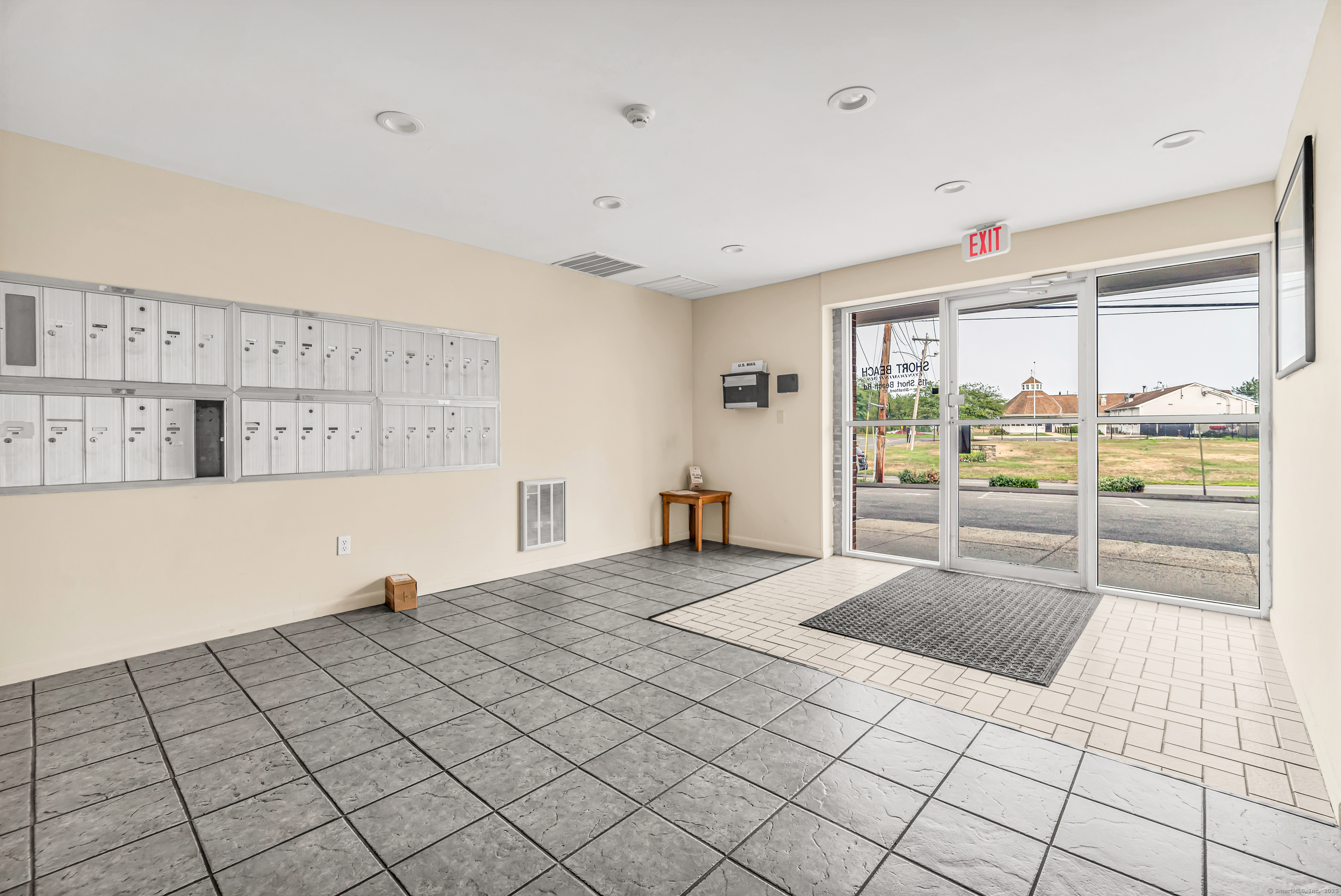 115 Short Beach Road, Unit 104 Stratford, CT 06615 - Photo 16 of 19 a room with a bed and a large window