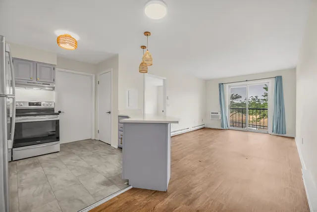 a view of an empty room with a window