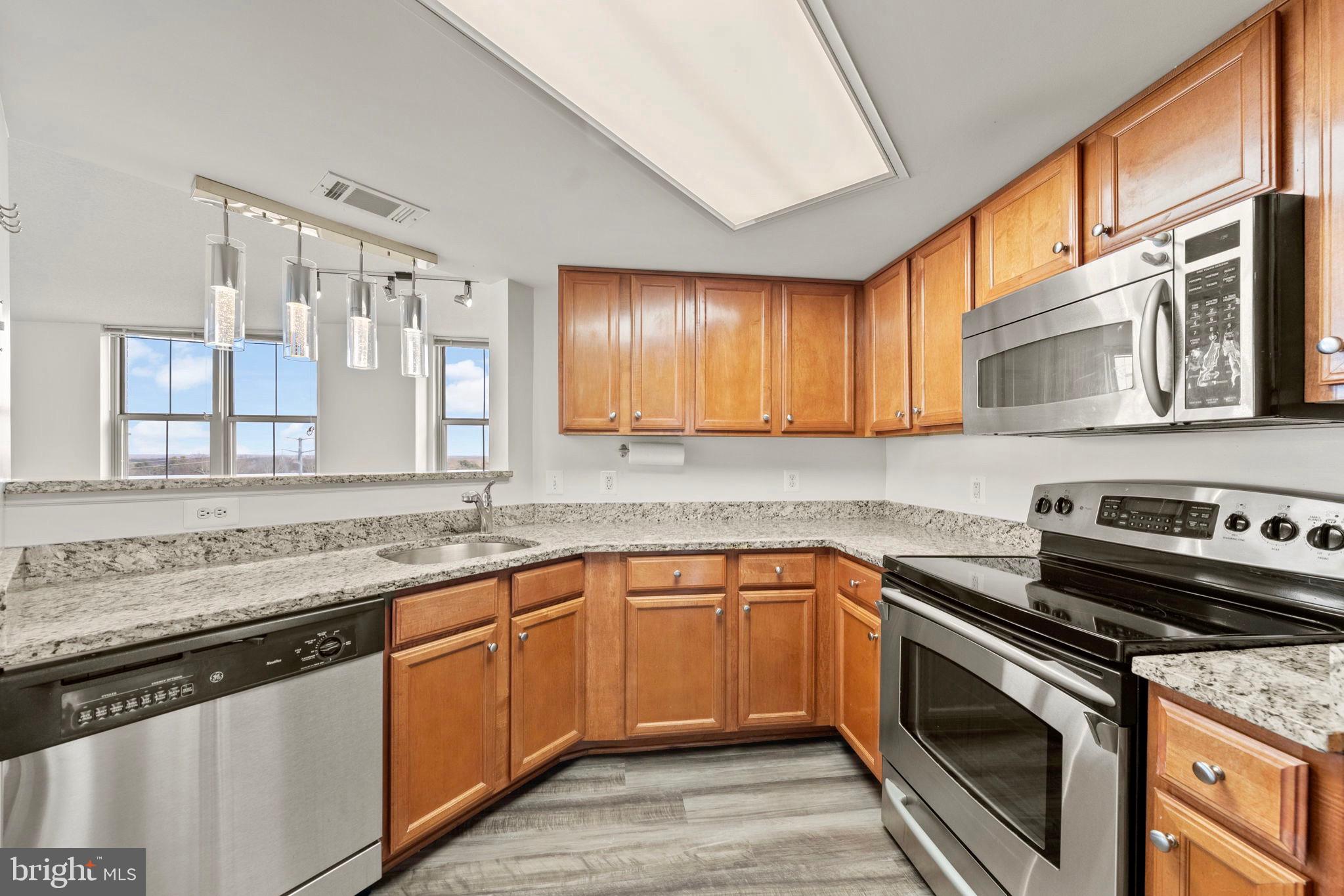 11800 Sunset Hills Road, Unit 1005 Reston, VA 20190 - Photo 17 of 42 Gourmet kitchen w/granite & SS appliances