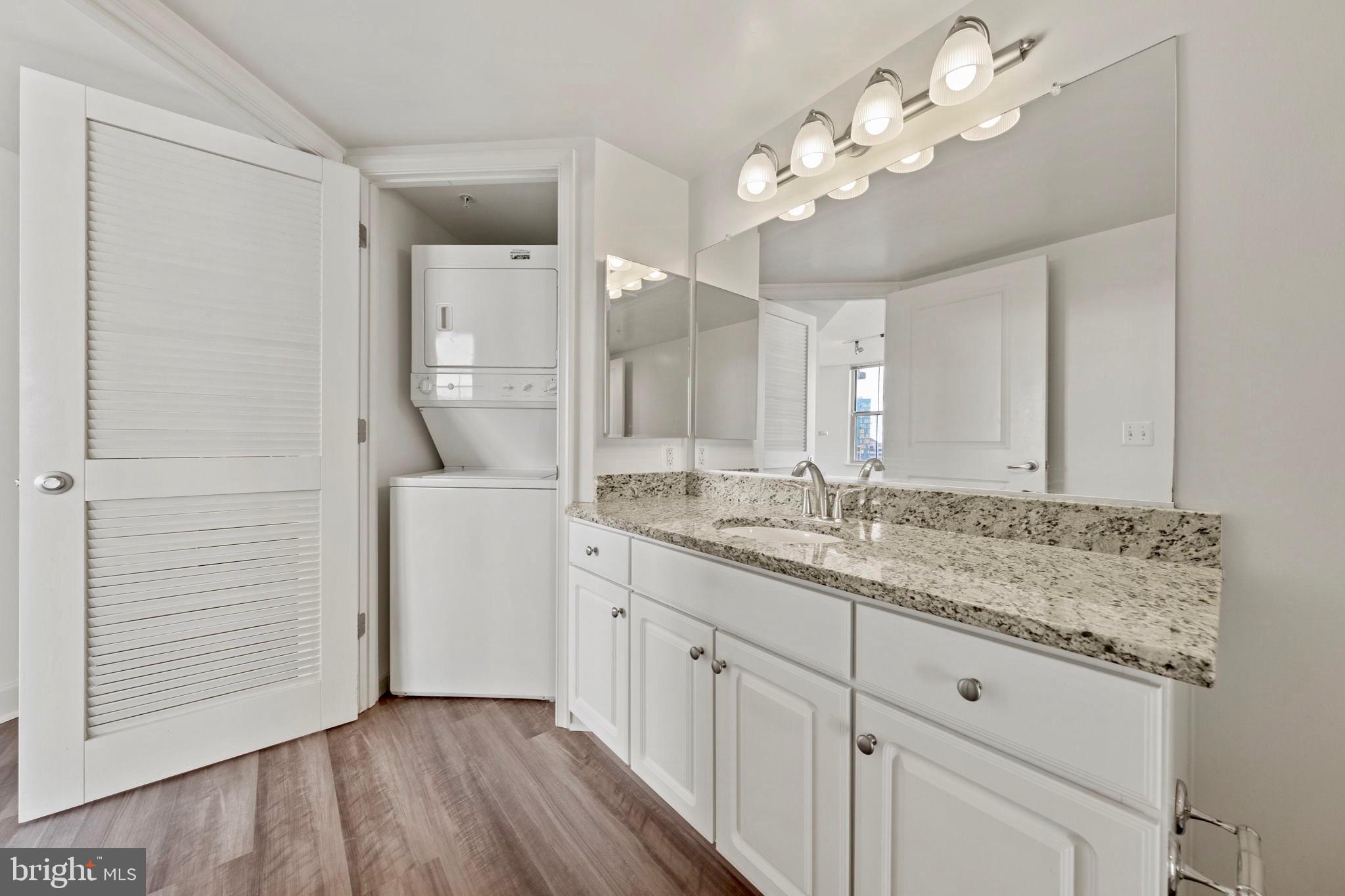 11800 Sunset Hills Road, Unit 1005 Reston, VA 20190 - Photo 23 of 42 2nd bath features oversized vanity w/granite & W/D