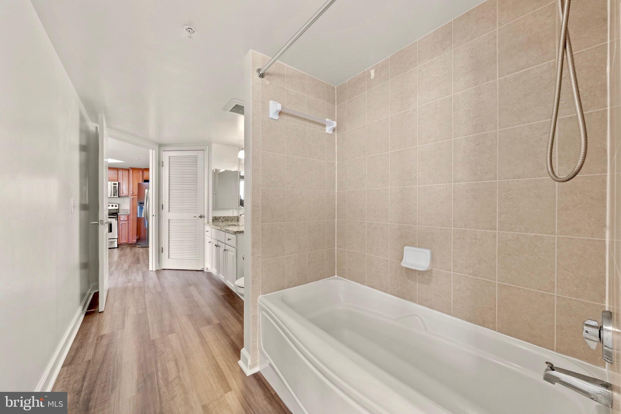 11800 Sunset Hills Road, Unit 1005 Reston, VA 20190 - Photo 24 of 42 Deep set shower-tub with ceramic tile