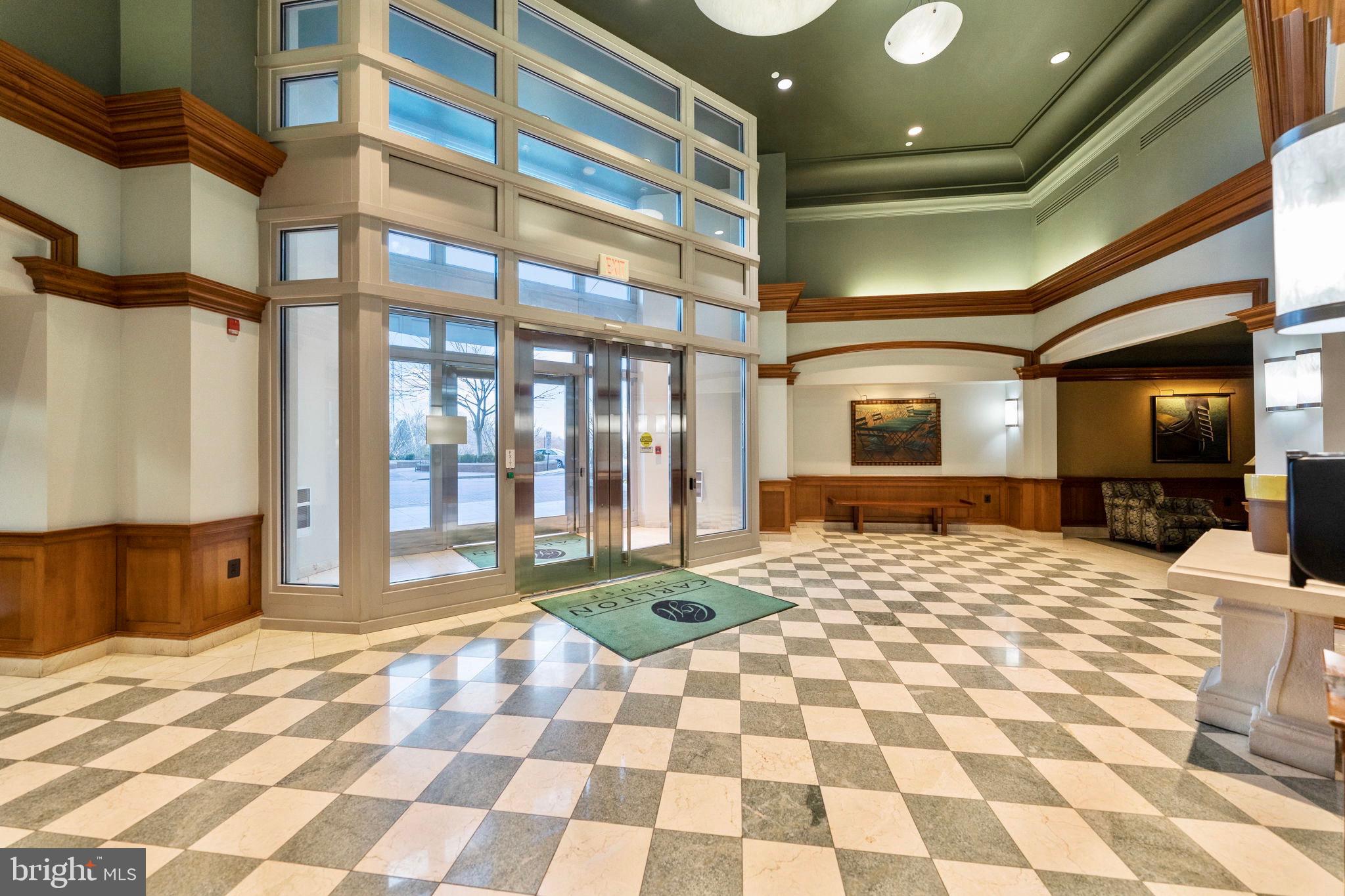 11800 Sunset Hills Road, Unit 1005 Reston, VA 20190 - Photo 26 of 42 Carlton House secure lobby entry w/front desk