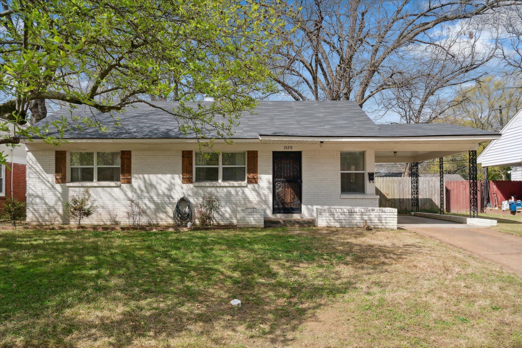 1529 Welsh Road Memphis, TN 38117 - Photo 1 of 27 a front view of house with yard
