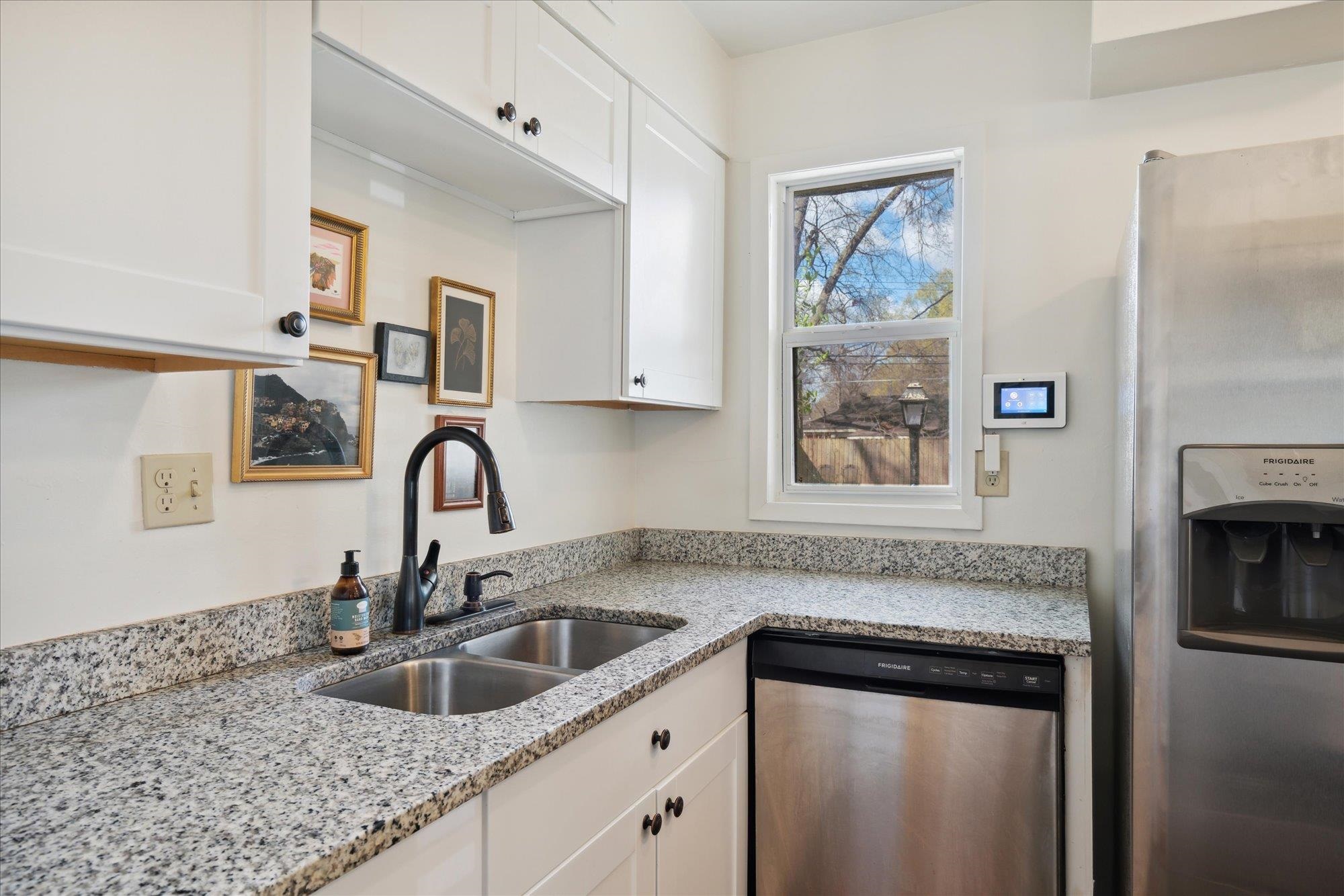 1529 Welsh Road Memphis, TN 38117 - Photo 15 of 27 a kitchen with granite countertop a sink stainless steel appliances and cabinets