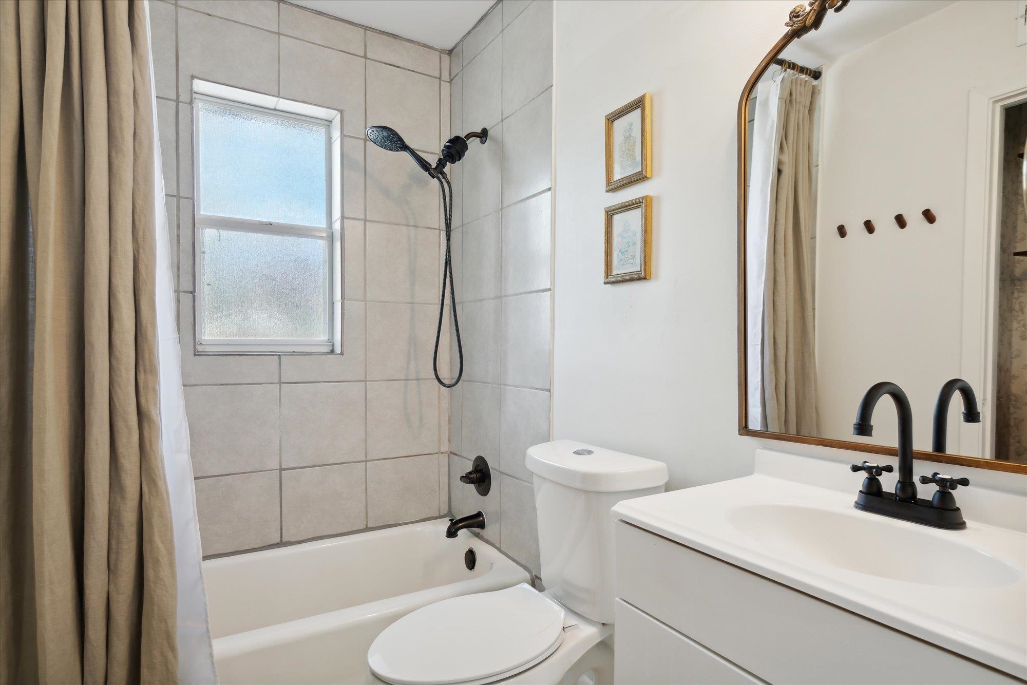 1529 Welsh Road Memphis, TN 38117 - Photo 17 of 27 a bathroom with a sink toilet and shower