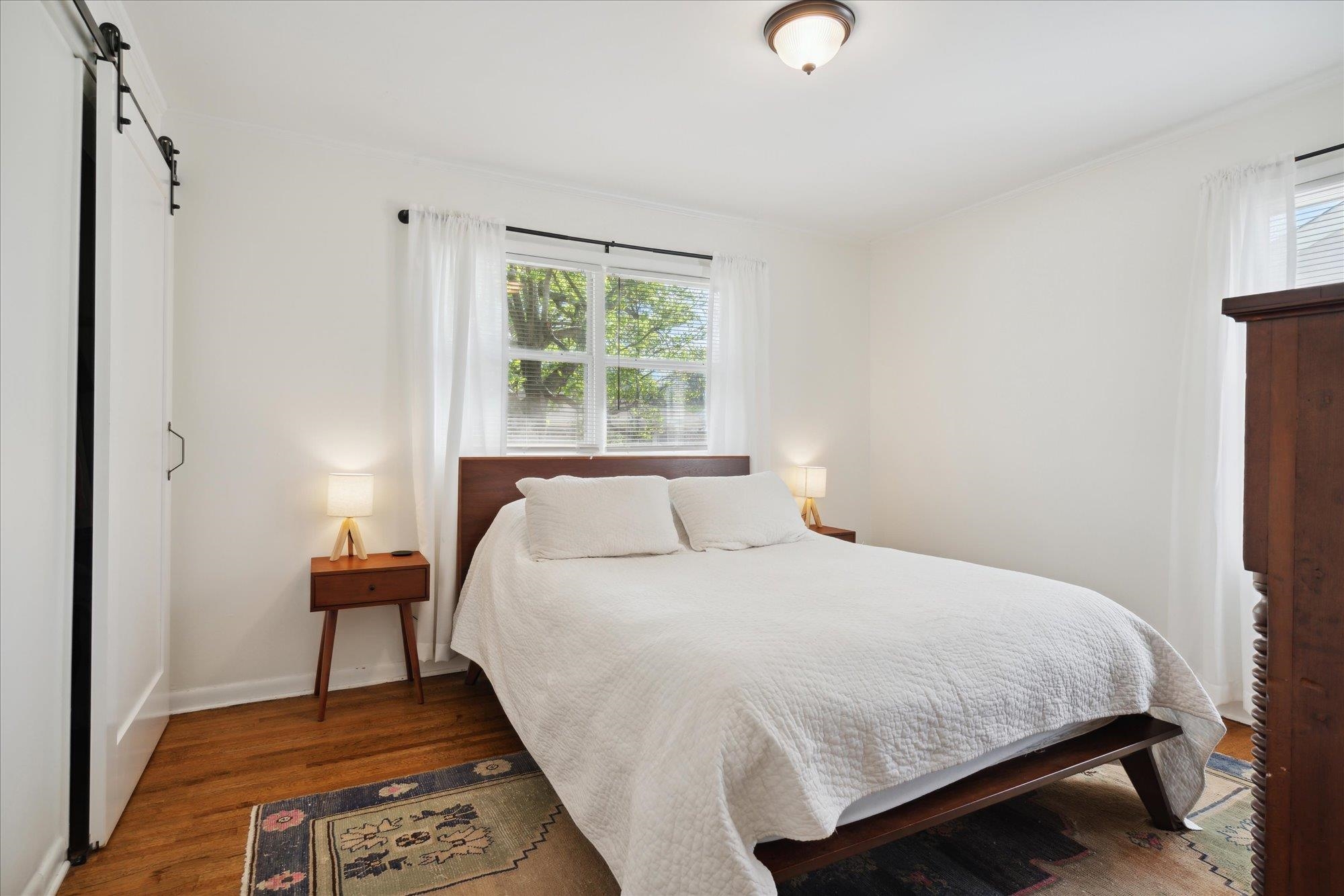 1529 Welsh Road Memphis, TN 38117 - Photo 20 of 27 a bedroom with a bed and wooden floor