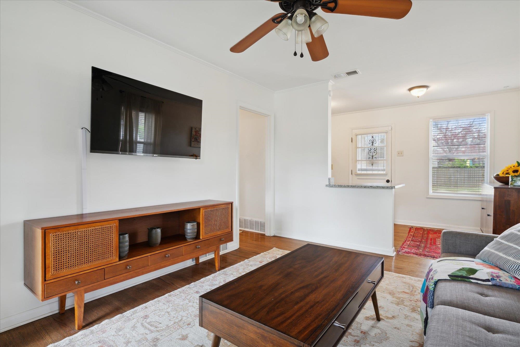 1529 Welsh Road Memphis, TN 38117 - Photo 8 of 27 a living room with furniture and a flat screen tv