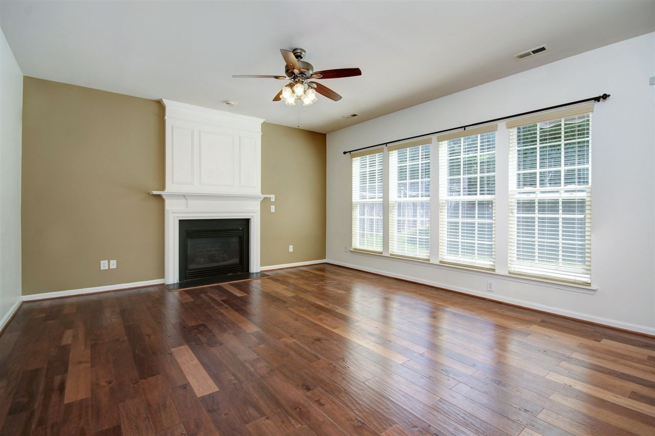 7444 Lagrange Drive Raleigh, NC 27613 - Photo 11 of 30 Big family room allows for plenty of natural light and feature a gas fireplace. Gleaming hardwoods and smooth ceilings with a ceiling fan. Family Room