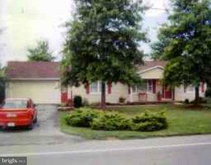 1468 Lancaster Road Manheim, PA 17545 - Photo 1 of 1 a front view of a house with a garden