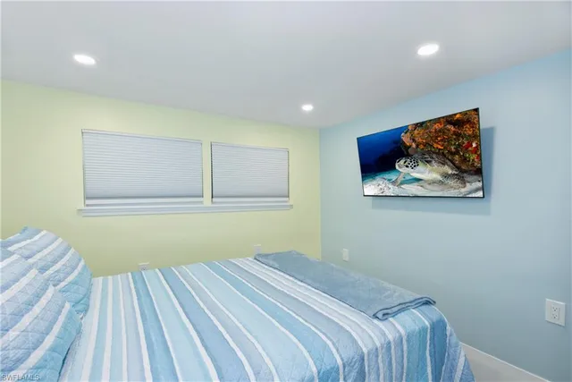 a bathroom with a tub shower and a sink