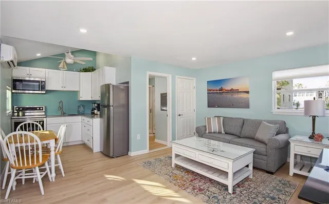 a bedroom with a bed and a lamp next to a window