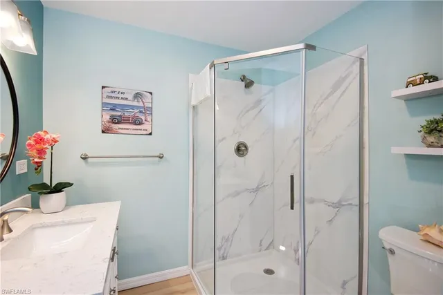 an aerial view of residential building with parking