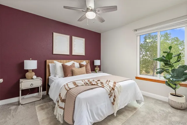 a bedroom with bed and a window