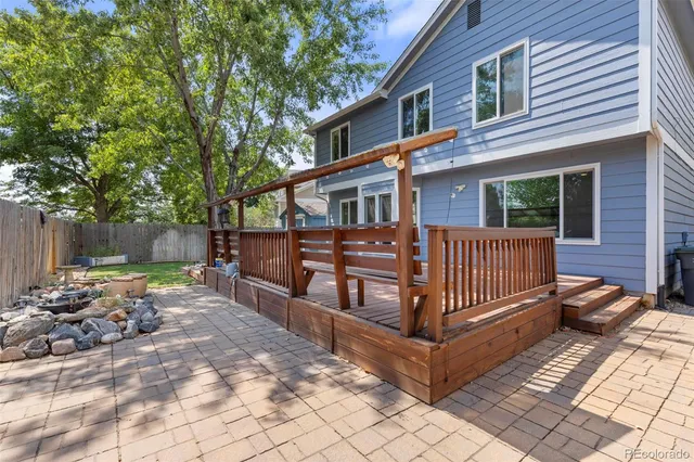 a view of a deck with a yard