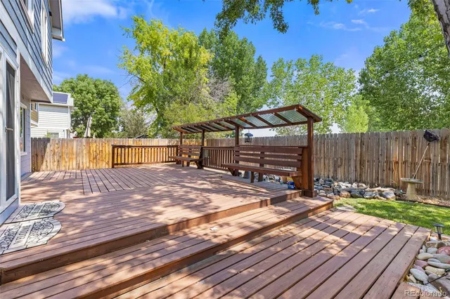 a view of a backyard with sitting area