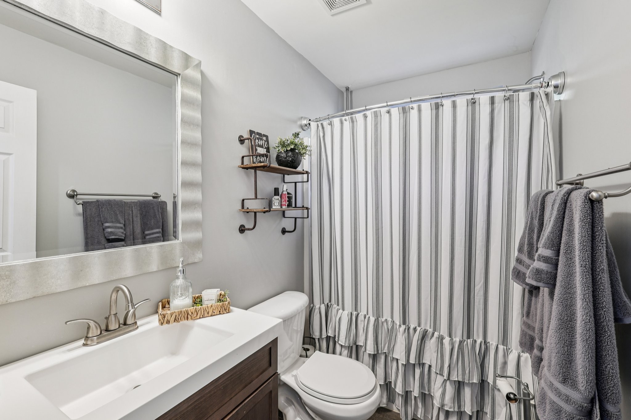 1613 Harrison Way Spring Hill, TN 37174 - Photo 25 of 38 a bathroom with a sink toilet and shower