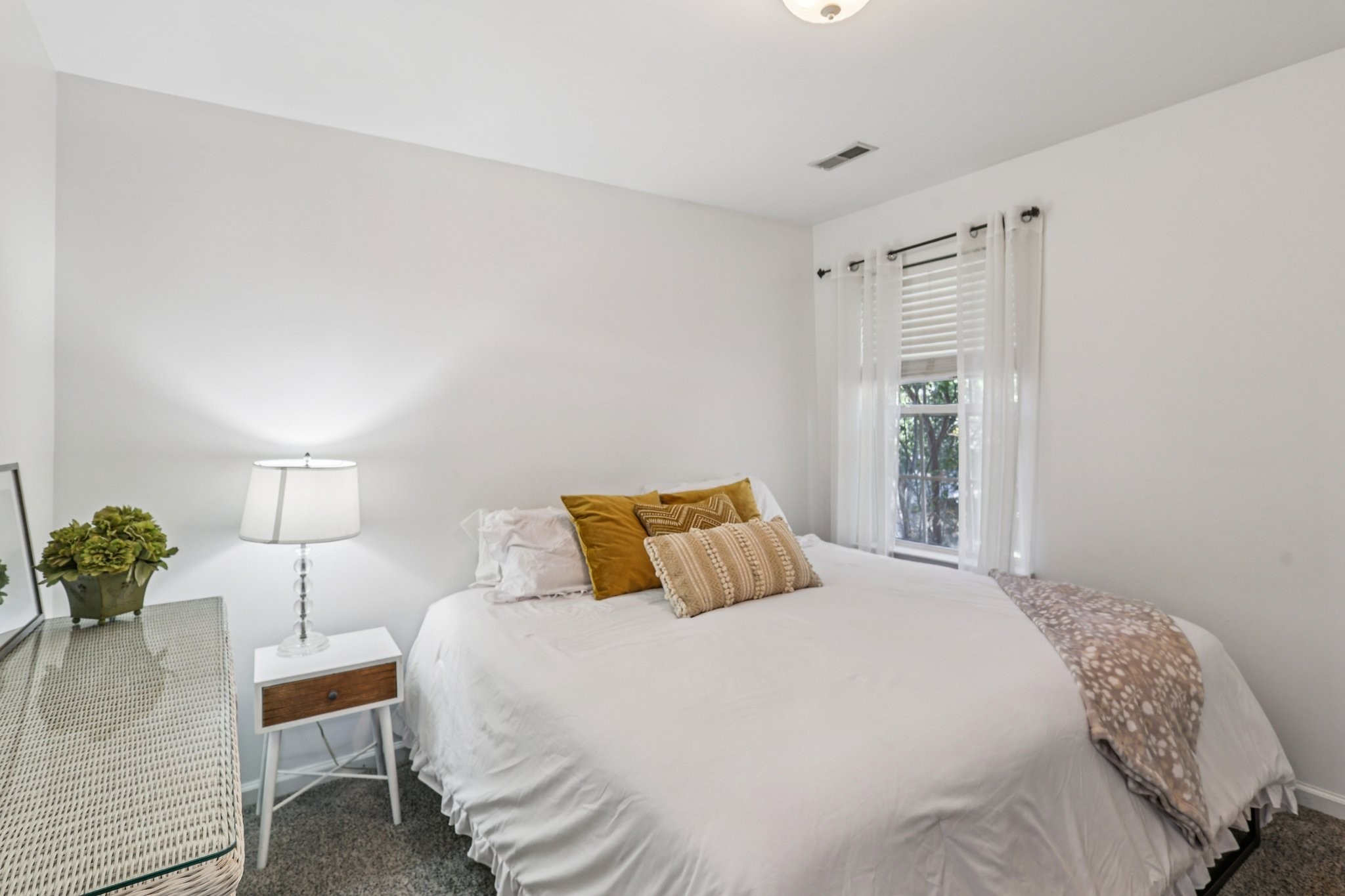 1613 Harrison Way Spring Hill, TN 37174 - Photo 26 of 38 a bedroom with a bed and a potted plant