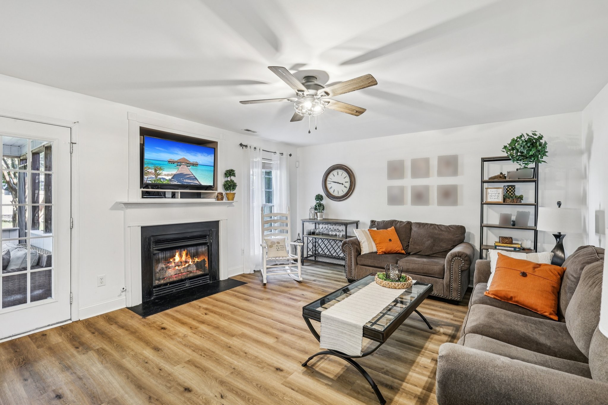 1613 Harrison Way Spring Hill, TN 37174 - Photo 4 of 38 a living room with furniture a fireplace and a flat screen tv