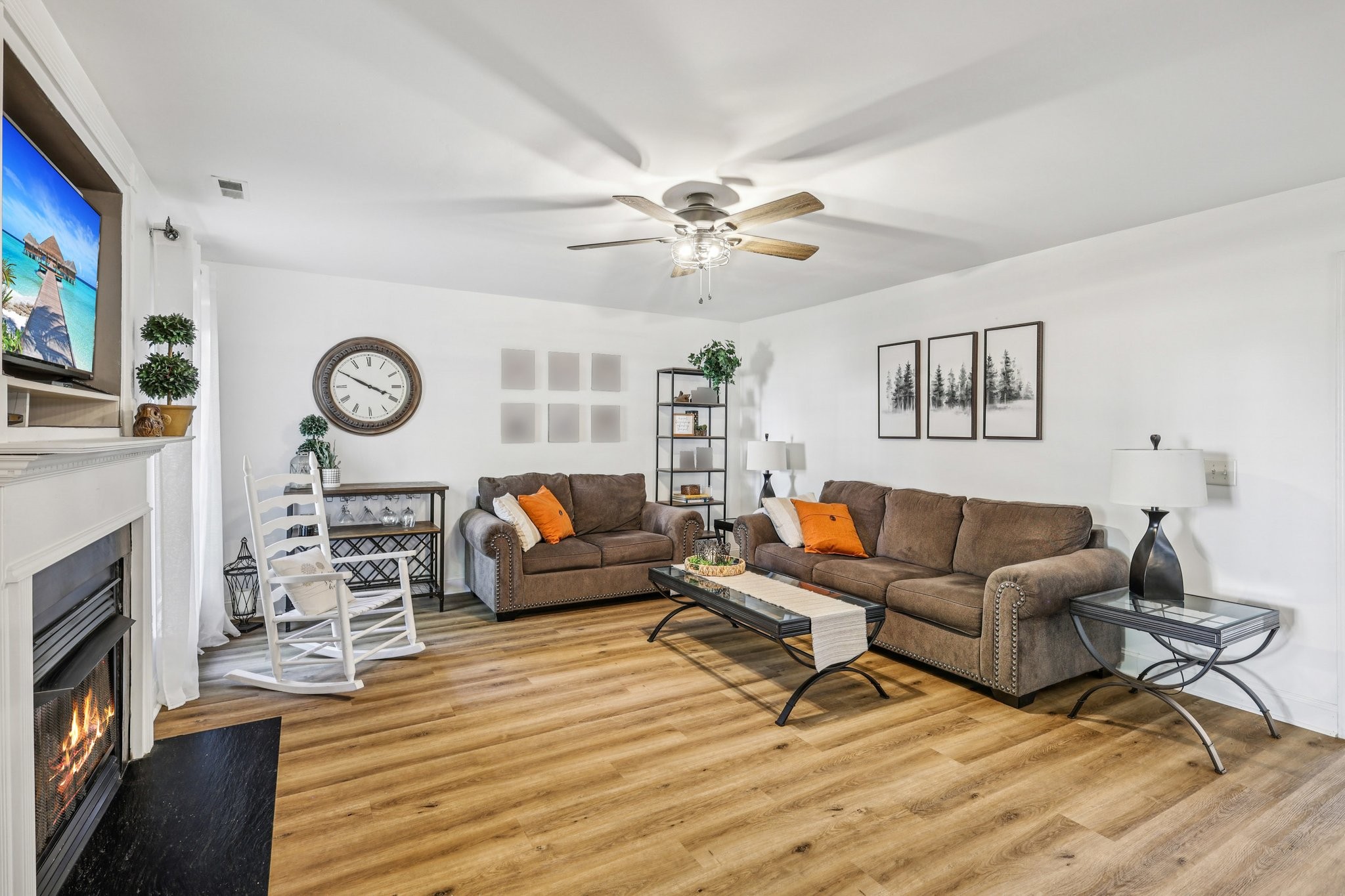 1613 Harrison Way Spring Hill, TN 37174 - Photo 5 of 38 a living room with furniture a fireplace and wooden floor