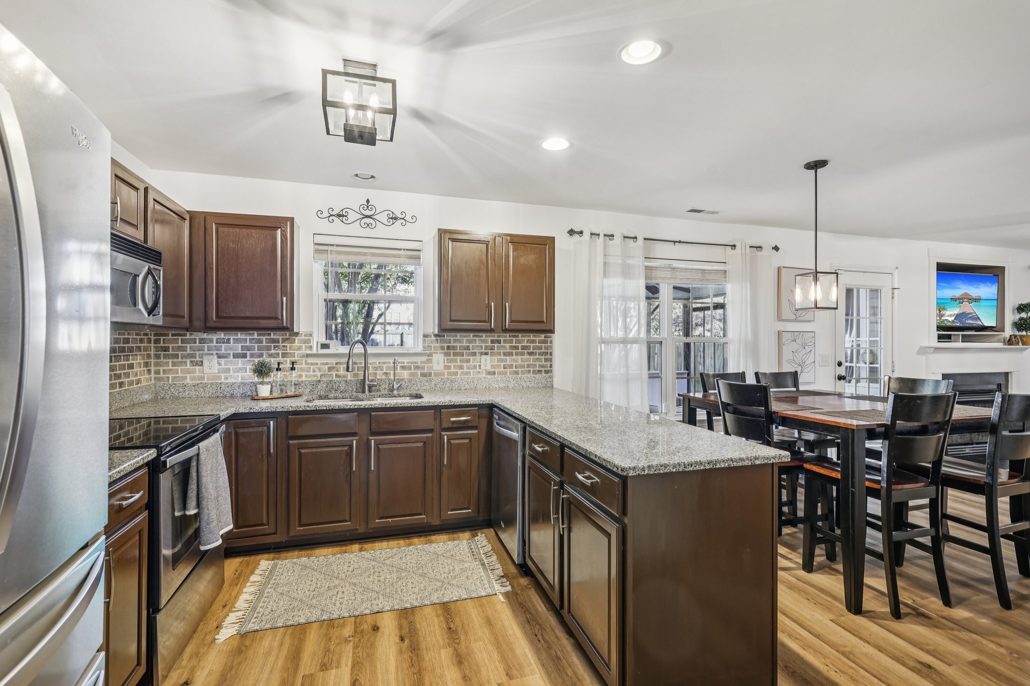 1613 Harrison Way Spring Hill, TN 37174 - Photo 9 of 38 a kitchen with stainless steel appliances granite countertop a sink stove and cabinets