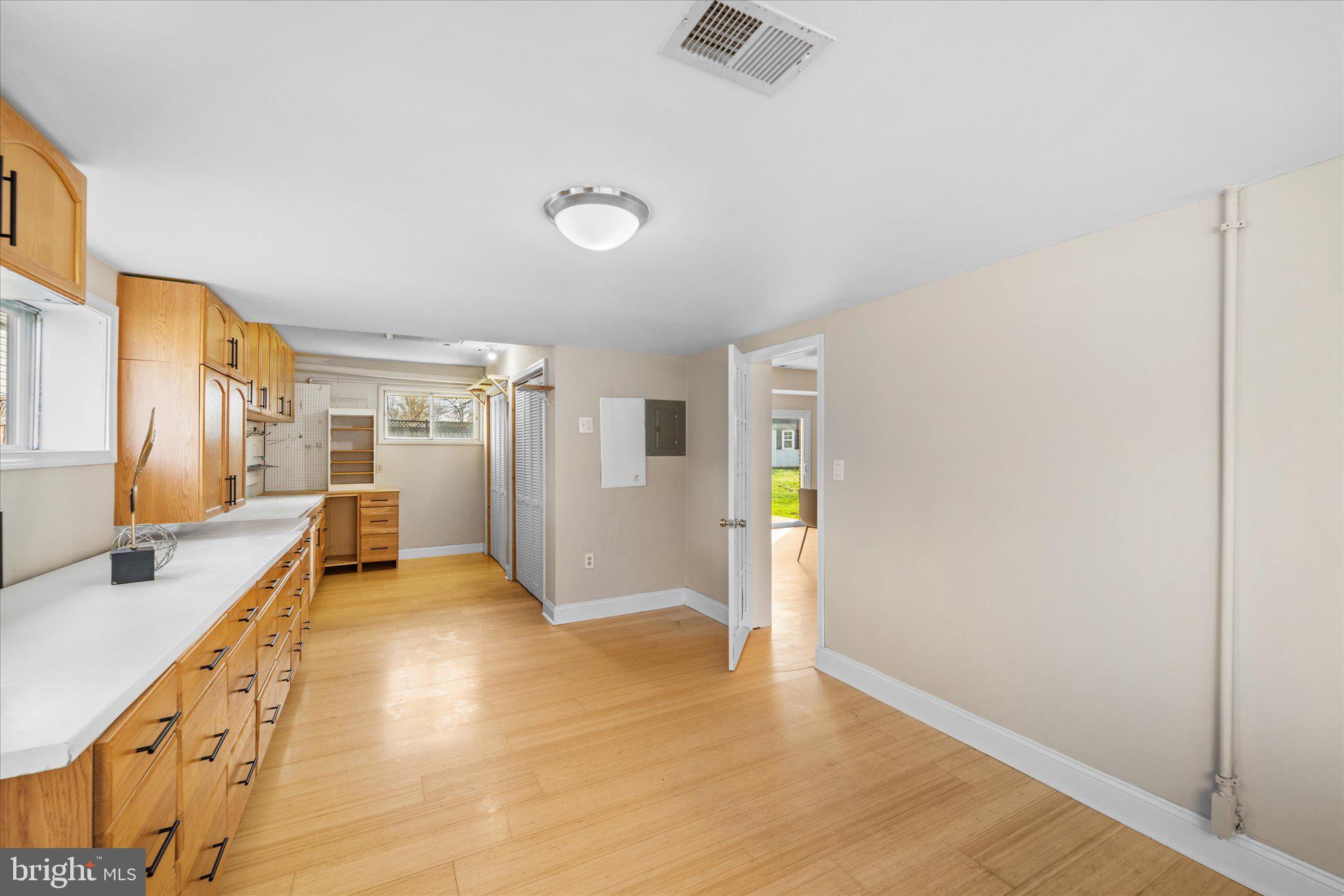 7312 Falmouth Street Springfield, VA 22150 - Photo 17 of 41 a view of a bedroom with wooden floor and stairs