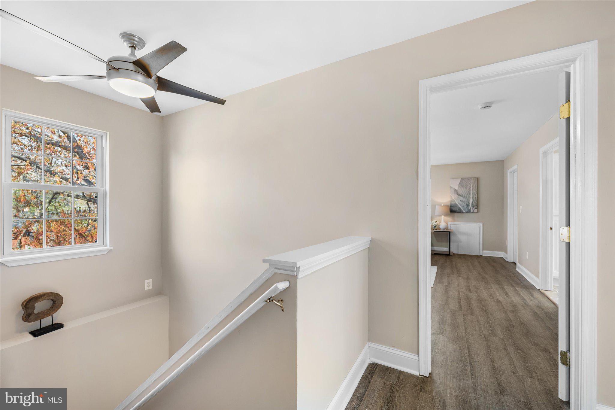 7312 Falmouth Street Springfield, VA 22150 - Photo 19 of 41 a view of a hallway view with wooden floor and staircase