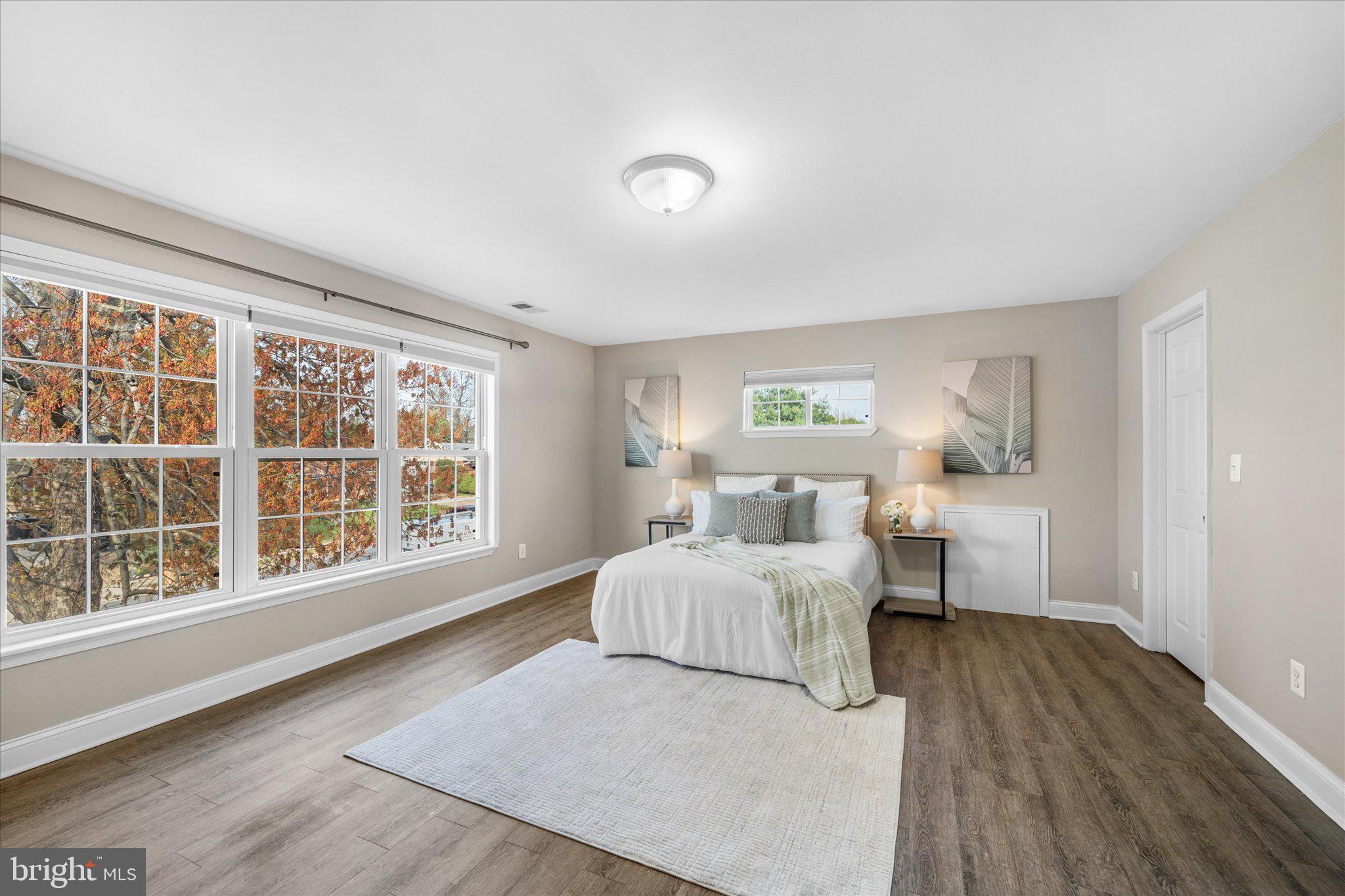 7312 Falmouth Street Springfield, VA 22150 - Photo 21 of 41 a bedroom with a large bed and a large window