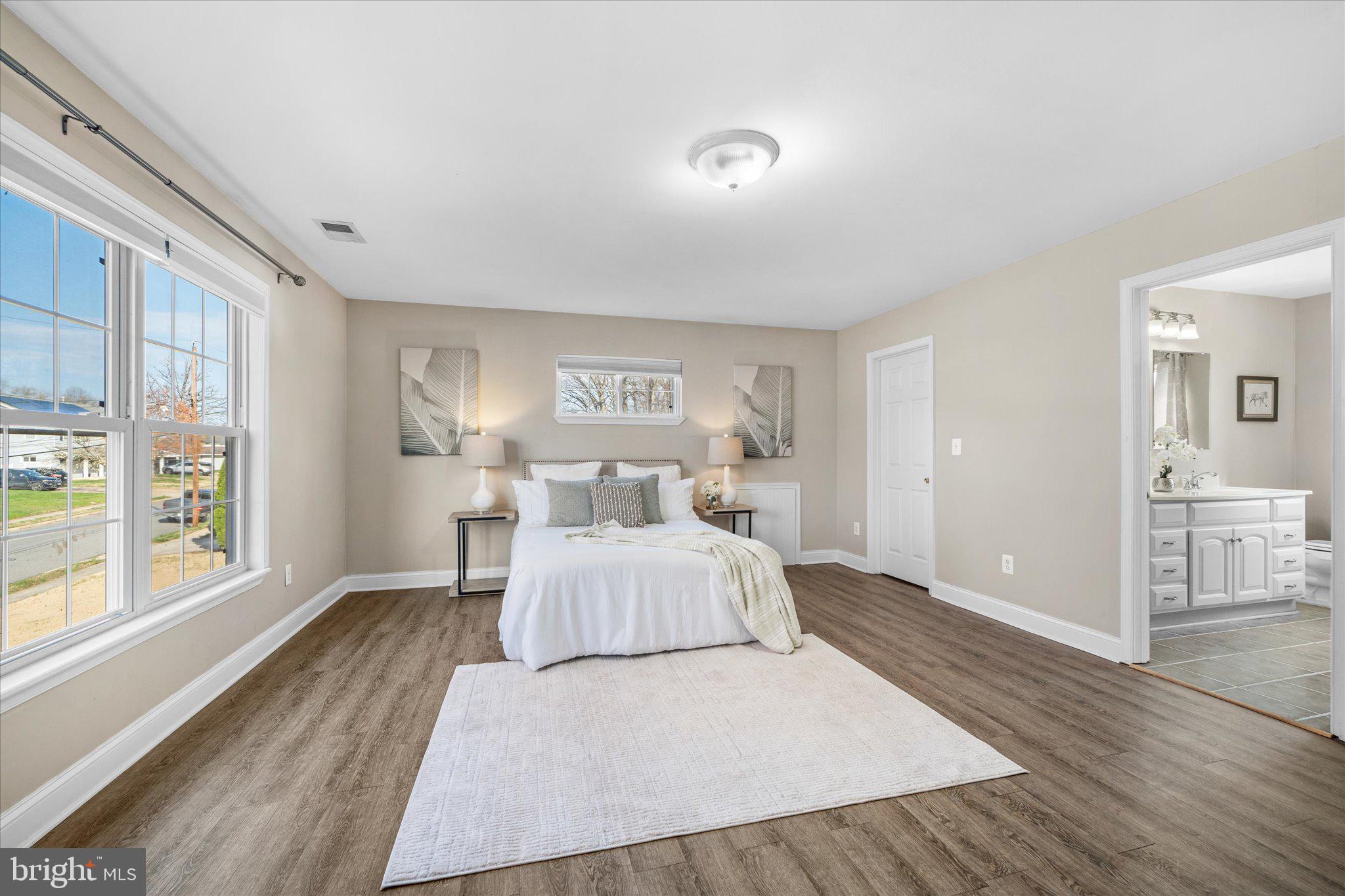7312 Falmouth Street Springfield, VA 22150 - Photo 22 of 41 a bedroom with a large bed and a large window