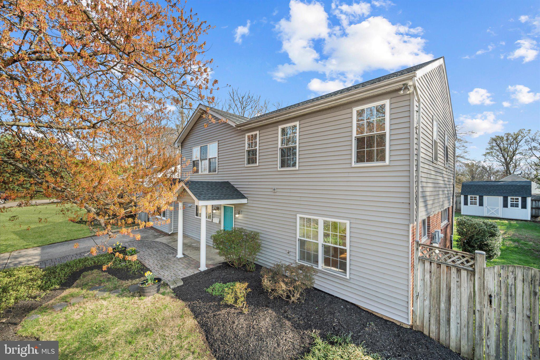 7312 Falmouth Street Springfield, VA 22150 - Photo 3 of 41 a front view of a house with garden