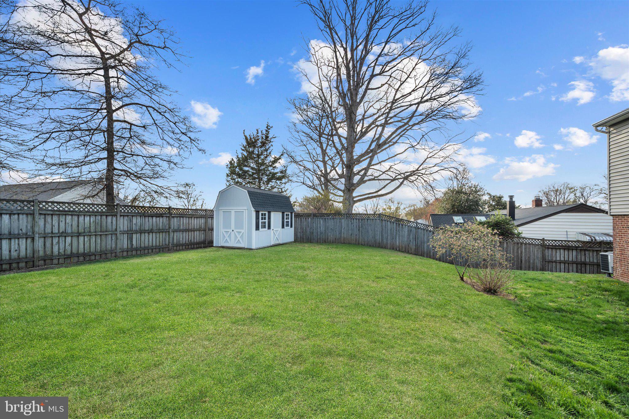 7312 Falmouth Street Springfield, VA 22150 - Photo 35 of 41 a view of a backyard with a large tree