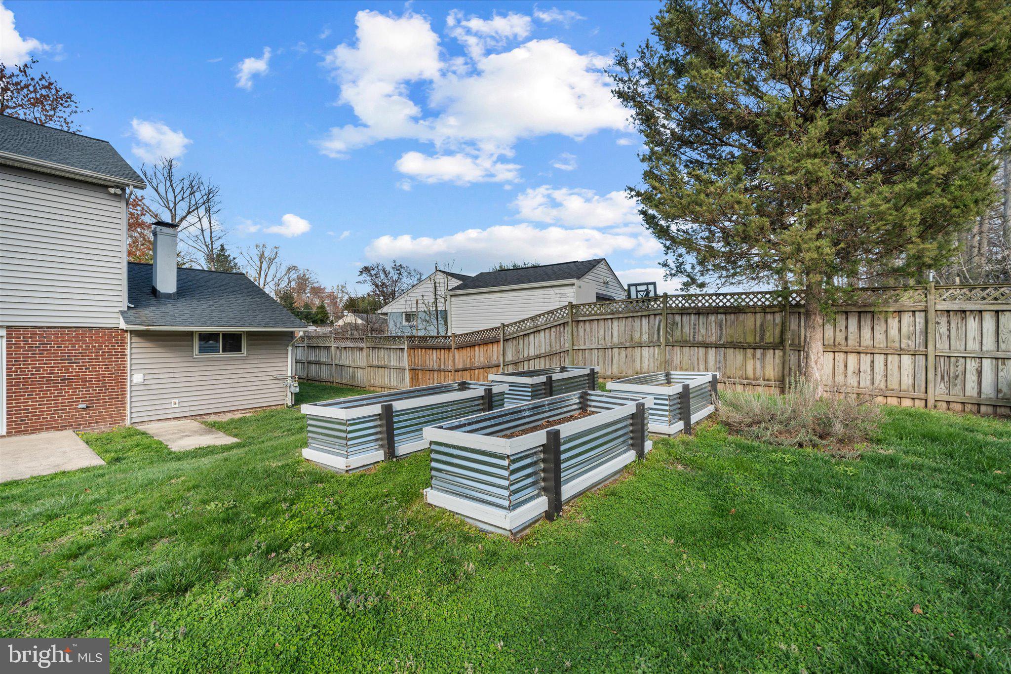 7312 Falmouth Street Springfield, VA 22150 - Photo 38 of 41 a view of a house with backyard and sitting area