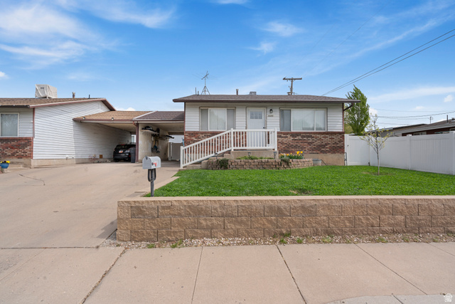 2086 North 175 West Sunset, UT 84015 - Photo 1 of 1 View of front of house featuring driveway, a carport, and brick siding