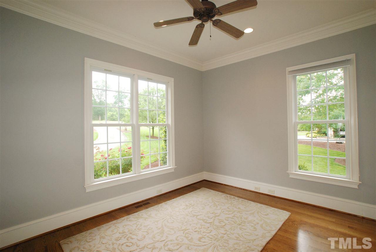1093 Tacketts Pond Drive Raleigh, NC 27614 - Photo 3 of 25 a view of a big room with wooden floor and windows in a room